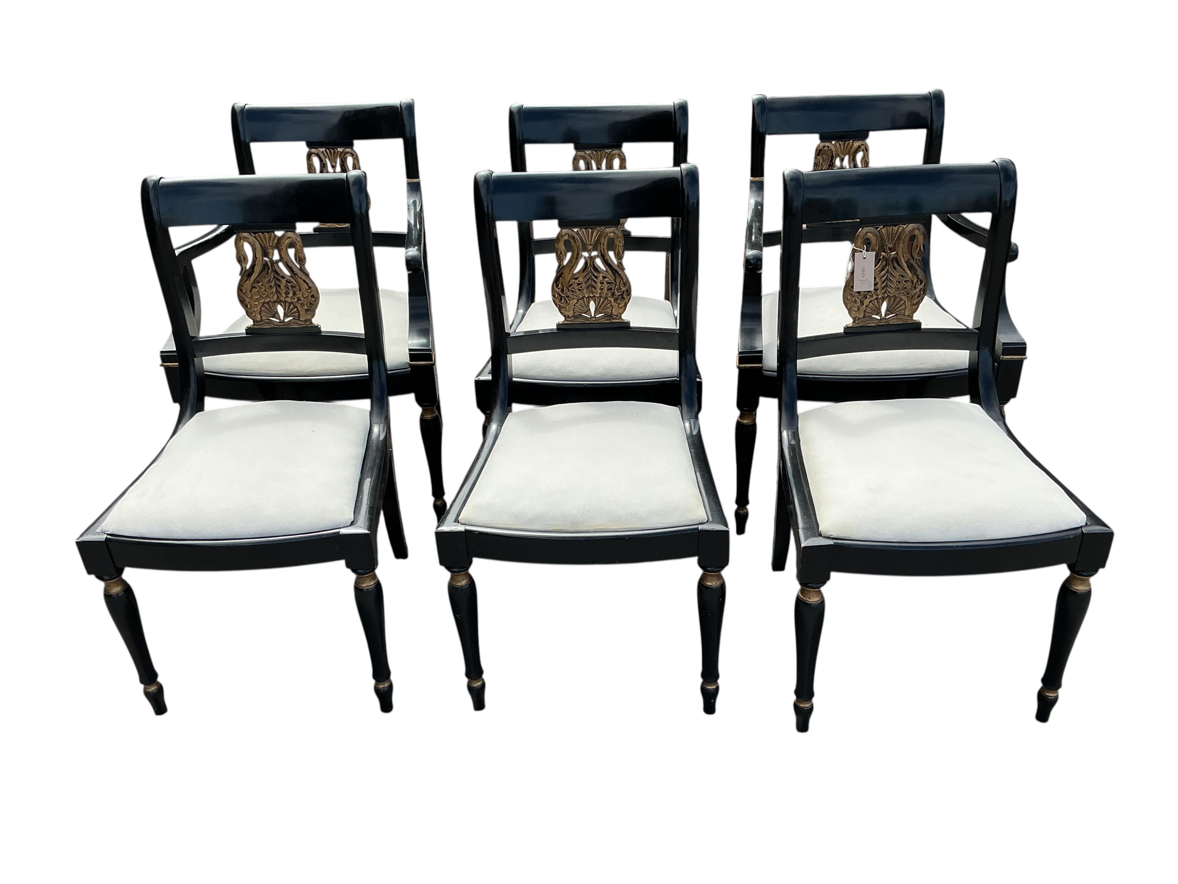 A set of six Empire style ebonised parcel gilt dining chairs, two with arms
